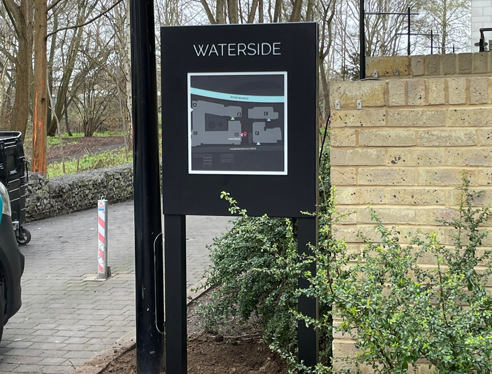 INTERNALLY ILLUMINATED WAYFINDING POST SIGN WITH FRET CUT TEXT